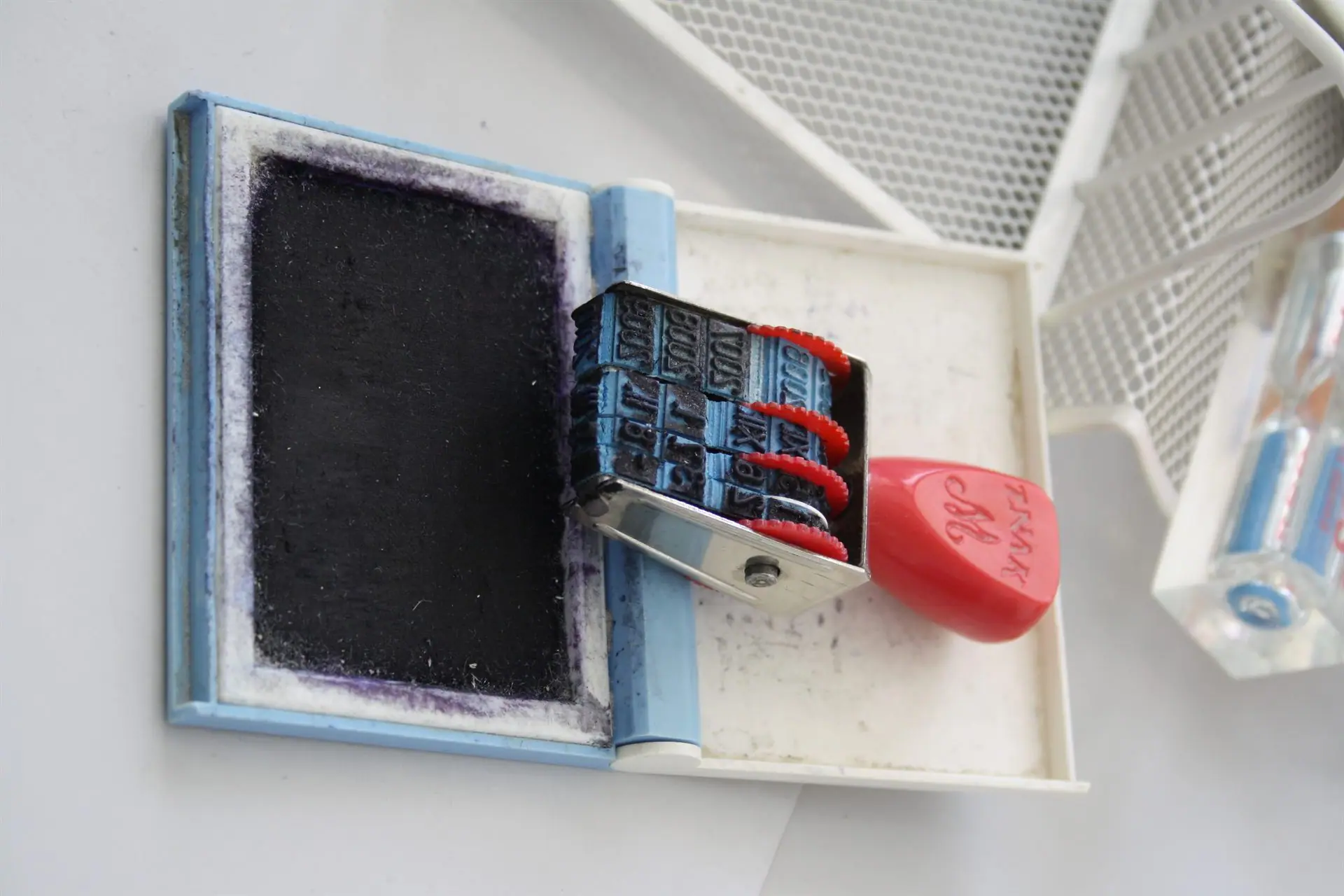 Office time stamp and ink pad on a desk